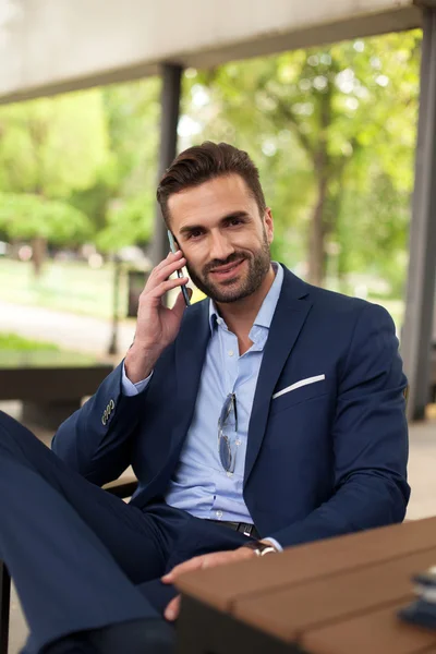 Young businessmen with cell phone — Stock Photo, Image