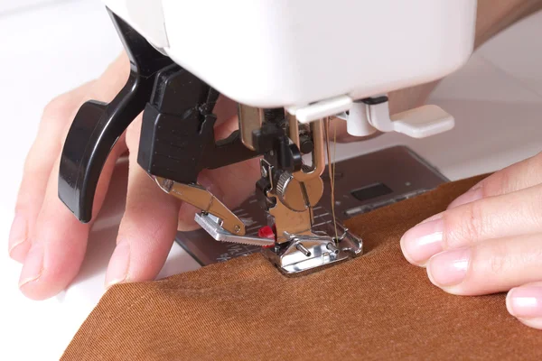 Woman sews — Stock Photo, Image