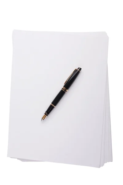 Old fountain pen lying on a stack of paper — Stock Photo, Image