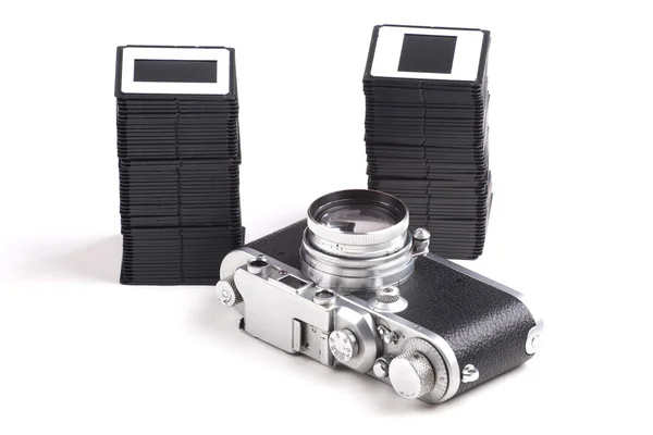 Old analog Camera and Stack of slides — Stock Photo, Image