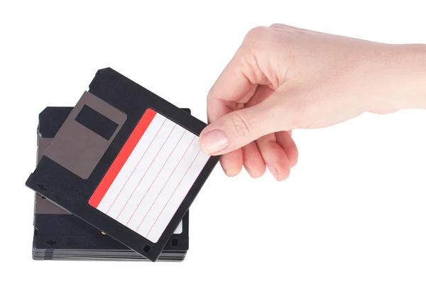 Female hand takes a floppy disk — Stock Photo, Image