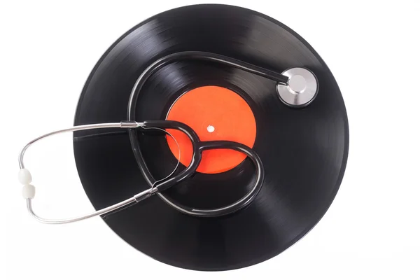 Stéthoscope posé sur disque vinyle — Photo