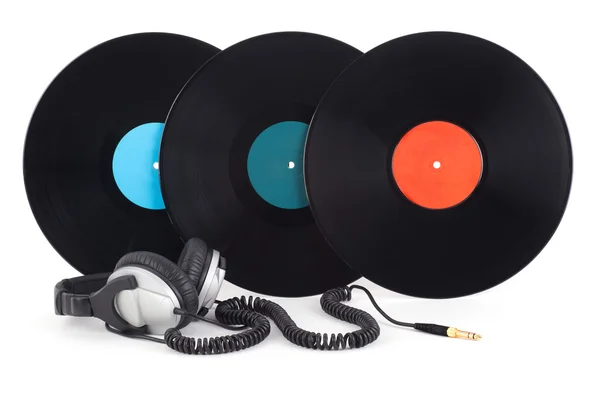 Headphones next to vinyl records — Stock Photo, Image