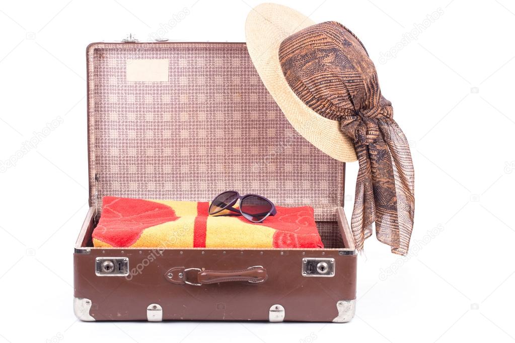 Open vintage suitcase with clothing