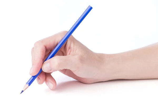 Mão feminina com um lápis azul — Fotografia de Stock