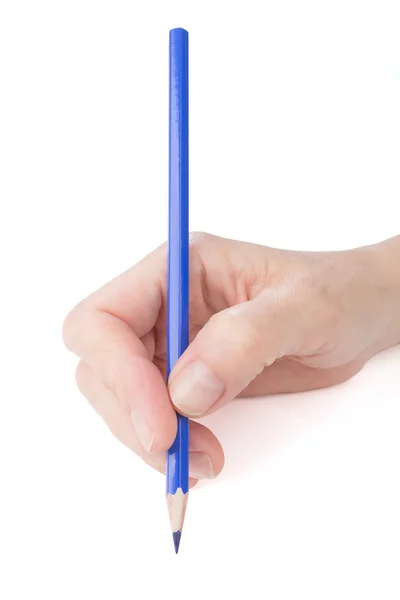 Mano femenina con un lápiz azul Imagen de stock
