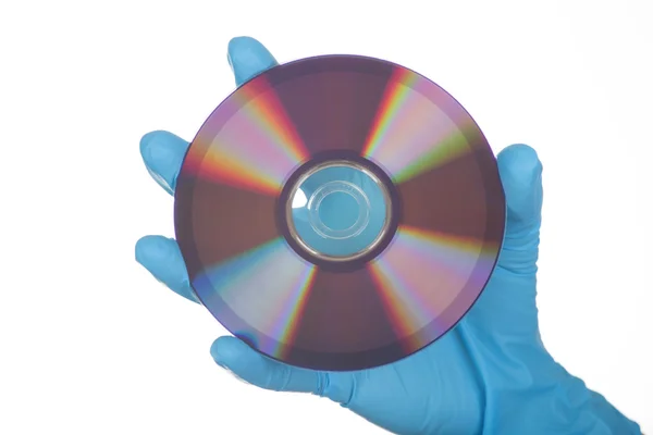 Female Hand in glove with dvd — Stock Photo, Image