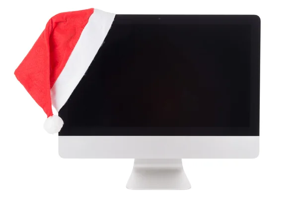 Κόκκινο καπέλο santa στην σύγχρονη οθόνη υπολογιστή — Φωτογραφία Αρχείου