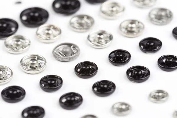 Metal buttons on cardboard — Stock Photo, Image