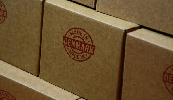 Made in Denmark stamp printed on cardboard box. Factory, manufacturing and production country concept.