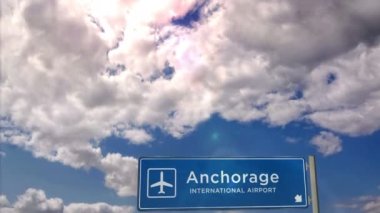 Jet uçağı Anchorage, Alaska, ABD 'ye iniyor. Havaalanı istikameti işaretli şehir gelişi. Seyahat, iş, turizm ve ulaşım konsepti. 3B canlandırma canlandırması.