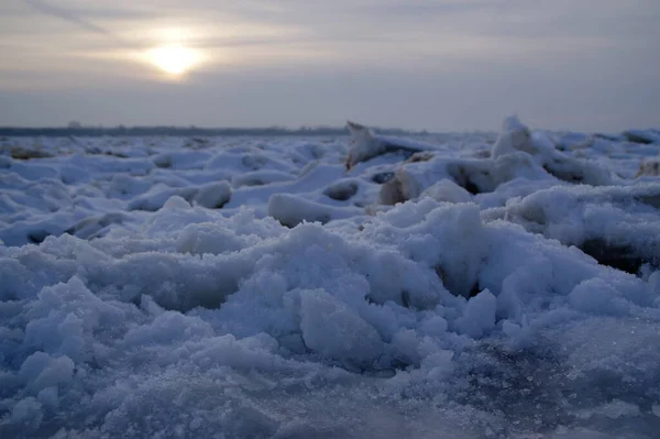 Ice floe in arctic with sun light. Sunset in winter season. Sun rays over glacier and frozen lake.