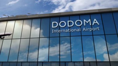 Dodoma, Tanzanya 'ya iniş yapan jet uçakları animasyon yapıyor. Cam havaalanı terminali ve uçağın yansıması ile şehre varış. Seyahat, iş, turizm ve ulaşım kavramı.