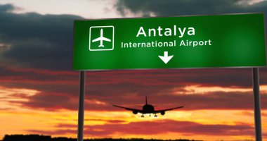 Türkiye 'nin Antalya kentine uçak silueti indi. Havaalanı yön tabelasıyla ve arka planda gün batımıyla şehre vardık. Trip ve ulaşım konsepti 3d illüstrasyon.
