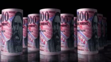 Macar Forint para ruloları 3D animasyon döngüsü. HUF 'un önünde hareket eden bir kamera var. Macaristan 'da kusursuz ekonomi, finans, nakit, iş ve borç kavramı.