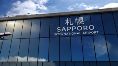 Japonya, Sapporo 'ya üç boyutlu bir jet uçağı iniyor. Cam havaalanı terminali ve uçağın yansıması ile şehre varış. Seyahat, iş, turizm ve ulaşım kavramı.