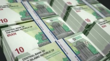 İran Rial para paketi 3D animasyon döngüsü. İran 'da kusursuz finans, nakit, ekonomi, iş ve banka kavramı. IRR banknot desteleri üzerinde hareket eden kamera.
