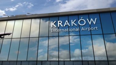 Krakow, Cracow, Polonya 'ya iniş yapan bir jet uçağı 3 boyutlu animasyonu canlandırıyor. Cam havaalanı terminali ve uçağın yansıması ile şehre varış. Seyahat, iş, turizm ve ulaşım kavramı.