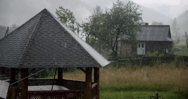 Rain in the village in summer. Slow motion — Stock Video