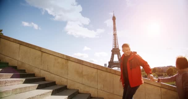 Young couple in Paris running up the stairs. Slow motion — Stock Video