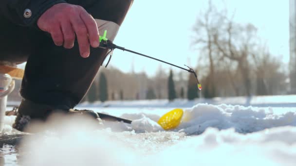 Close up fishing rod for sunny winter day. fishing is caught in a hole in the ice Vercion 2 — Stock Video