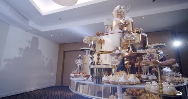 A large, beautiful, golden buffet with many sweet snacks, a candy bar. Vercion 2 — Stock Video