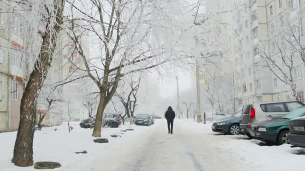 People walk on snowy road street. Slow motion — Stock Video