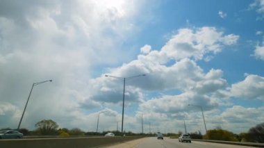 POV view from the cab of a car driving on a highway. 