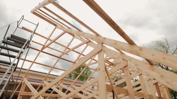 Modern American home, Roof beamsin mid construction phase, looking up towards — стоковое видео