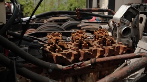 Close up shot of parts Old engine Broken Truck in a Scrap Yard near the City — ストック動画