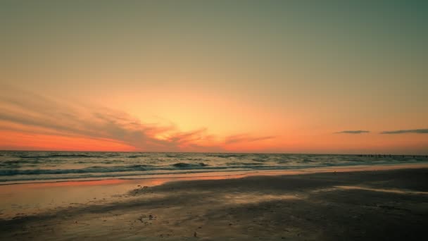 Wide futage of Golden sea sunrise. Slow motion of Burning sky and shining golden waves. — Stockvideo
