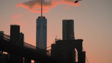 Siluet view elements of Brooklyn Bridge in New York at sunset. USA