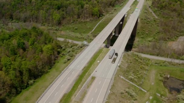 Aerial drone shot. Truck rides on road that turns. — Wideo stockowe