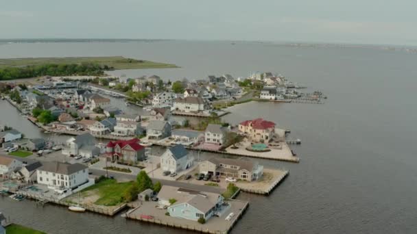 Local residential suburb of river in view of distant Toms River. USA Aerial drone — Stock Video