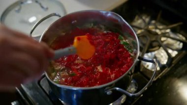 Cooking Beet Soup borscht in Pot on Stove at home. High quality 4k footage