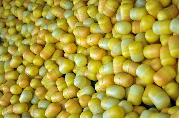 Yellow capsules kinder eggs surprises — Stock Photo, Image