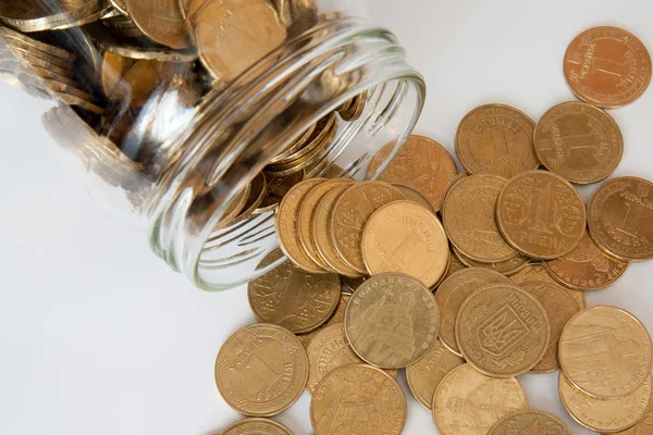 Coin in money jar Stock Photo