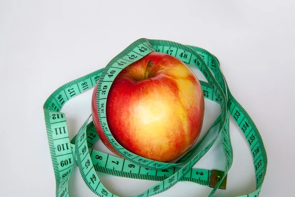 Apple with a ruler — Stock Photo, Image