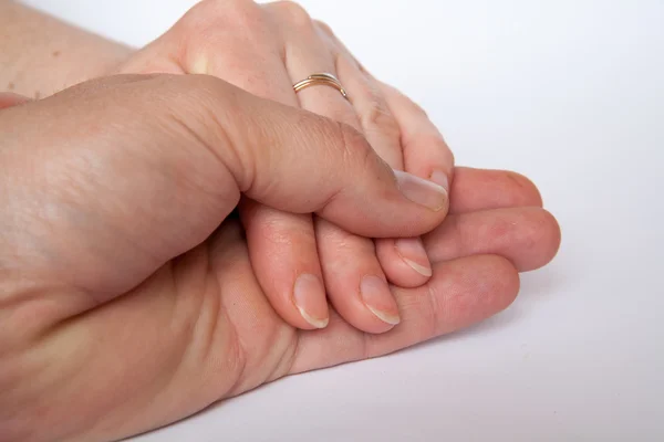 Beyaz arkaplanda birleşik eller — Stok fotoğraf