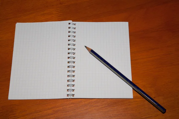 Pencil on a notebook — Stock Photo, Image