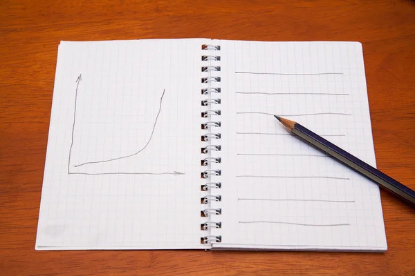 Pencil on a notebook — Stock Photo, Image