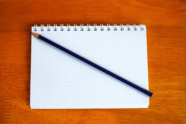 Pencil on a notebook — Stock Photo, Image