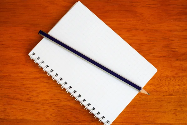 Pencil on a notebook — Stock Photo, Image