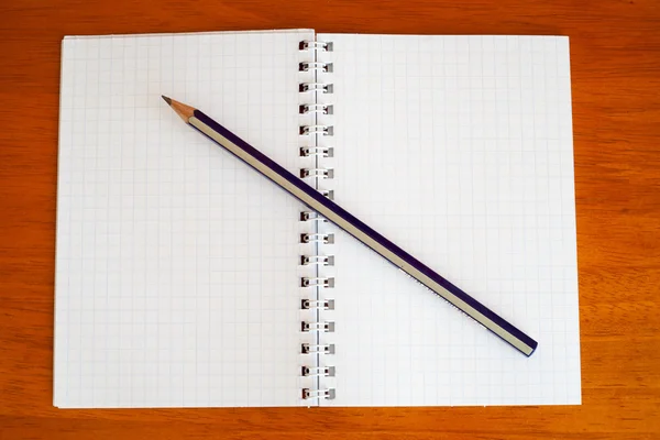 Pencil on a notebook — Stock Photo, Image