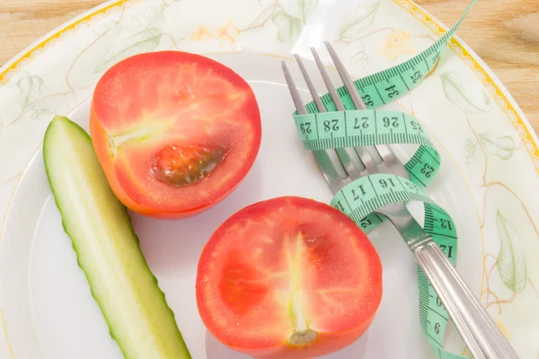 Cucumber and tomato with measuring — Stock Photo, Image