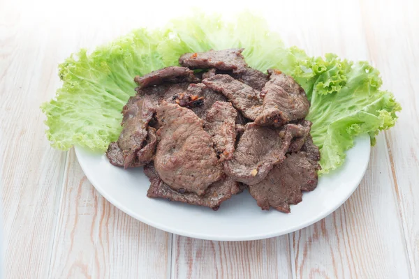 Home made beef stir fry with vegetables, close up on wood — Stock Photo, Image