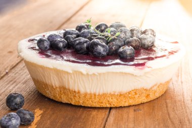 Blueberry cheese pie cake on wood table