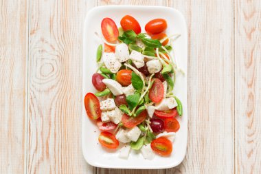 salad with mozzarella, tomato, basil