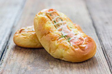 Bread with hot dog on old wood 