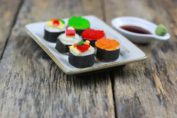 Sushi on old wood table background — Stok fotoğraf